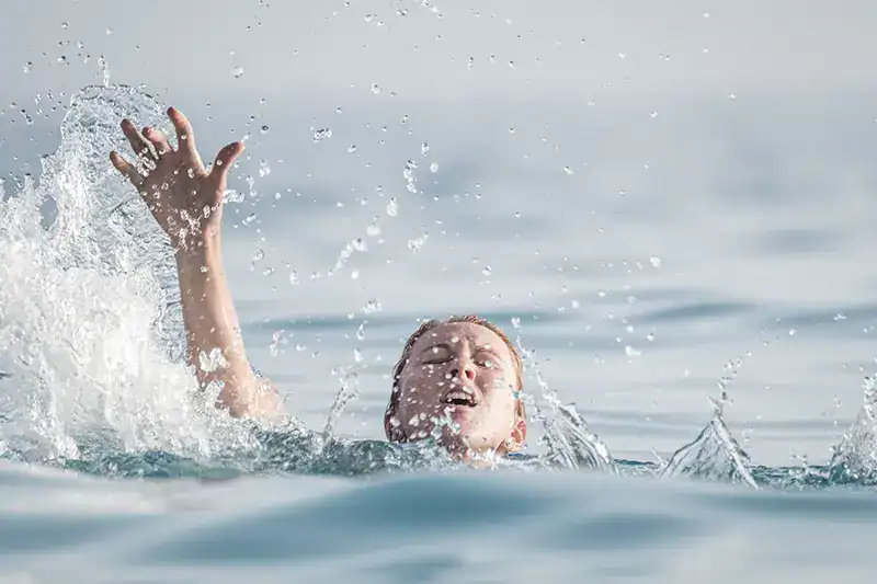 A woman drowning in the ocean